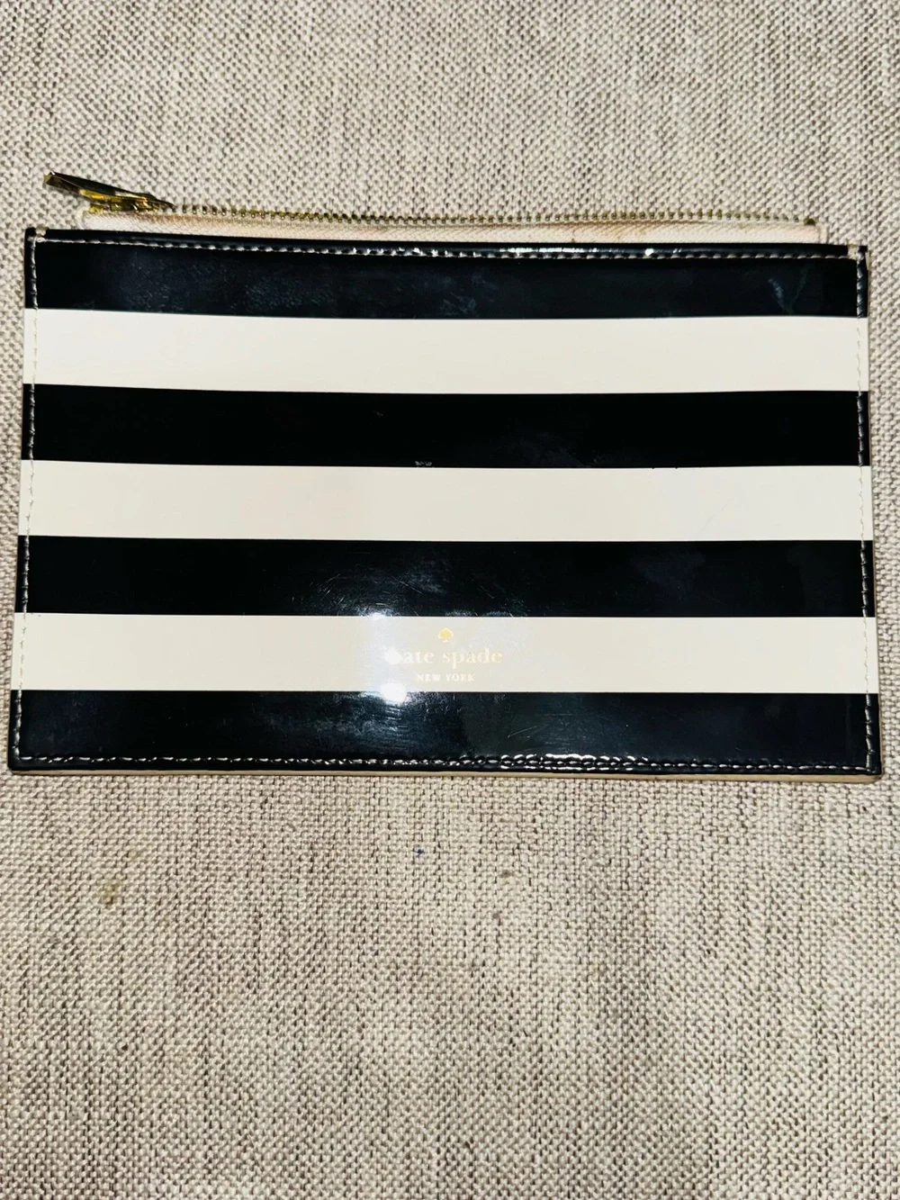 kate spade Black and White Striped Patent Zip Pouch